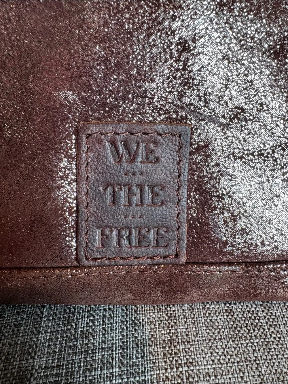 We The Free Brown / Gold Leather accordion zip wallet.